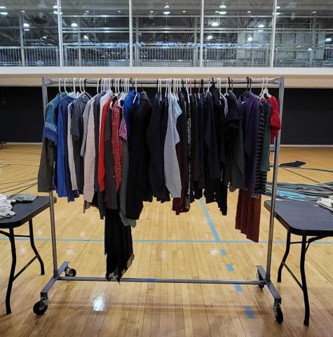 Clothes on hanging rack at the Stop and Swap event Clothes on hanging rack