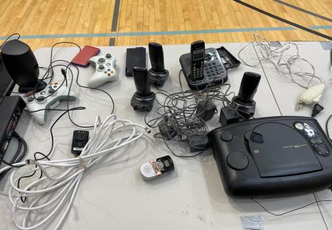 Table with electronics and video games systems at the Stop and Swap event Table with electronics and video games systems