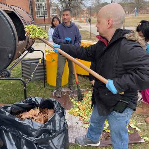 Composting Students are filling up the new composter at 6S
